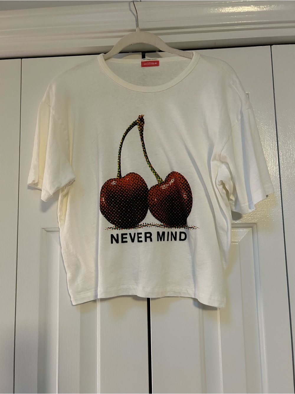 MOTHER White Tee with Red Cherry Graphic and 'NEVER MIND'